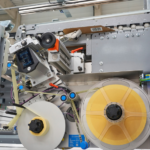 BAHMÜLLER and HERMA Develop Specialty Folder Gluer for Cardboard Box Labeling