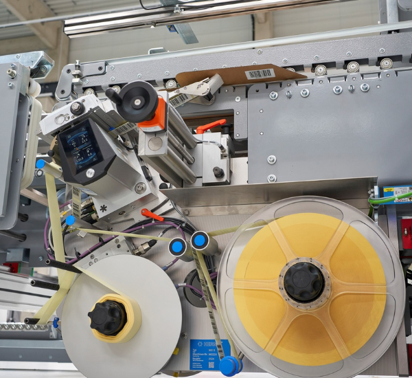 BAHMÜLLER and HERMA Develop Specialty Folder Gluer for Cardboard Box Labeling