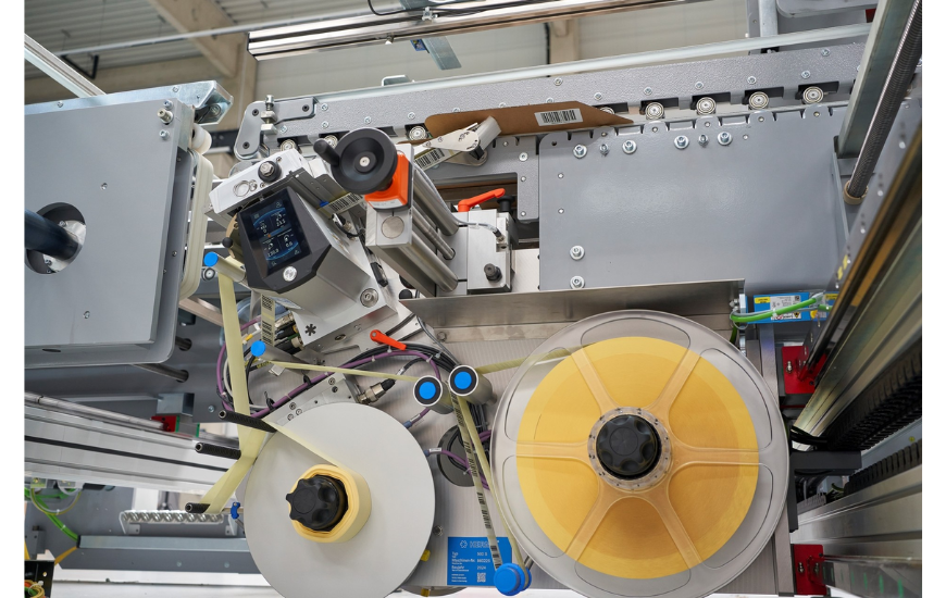 BAHMÜLLER and HERMA Develop Specialty Folder Gluer for Cardboard Box Labeling