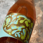Fedrigoni Advances Circularity with Wash-Off Labels for Glass Bottles